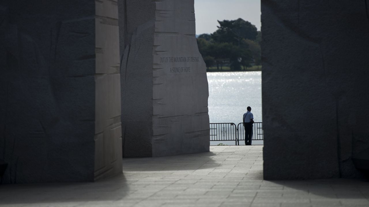 A U.S. Park Service police officer stands at the closed Martin Luther King Jr. Memorial on the National Mall in Washington on October 1.