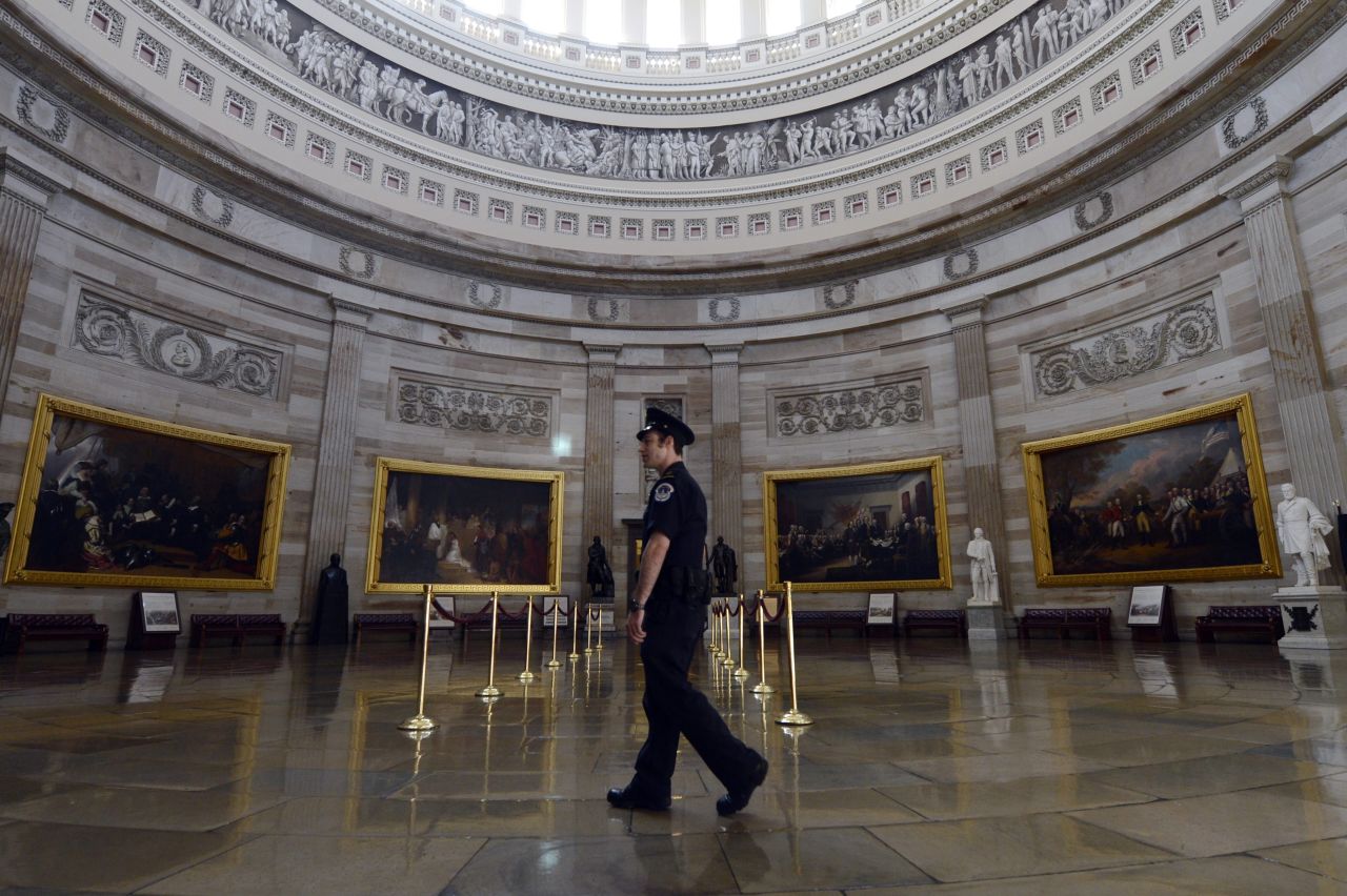 A Capitol police officer walks through the empty Capitol Rotunda, closed to tours during the government shutdown on Capitol Hill in Washington, on October 1. 