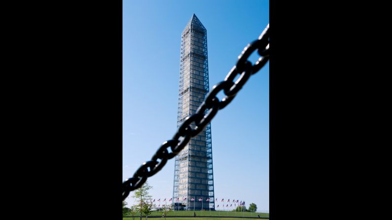 The Washington Monument is seen behind a chain fence in Washington, on October 1.
