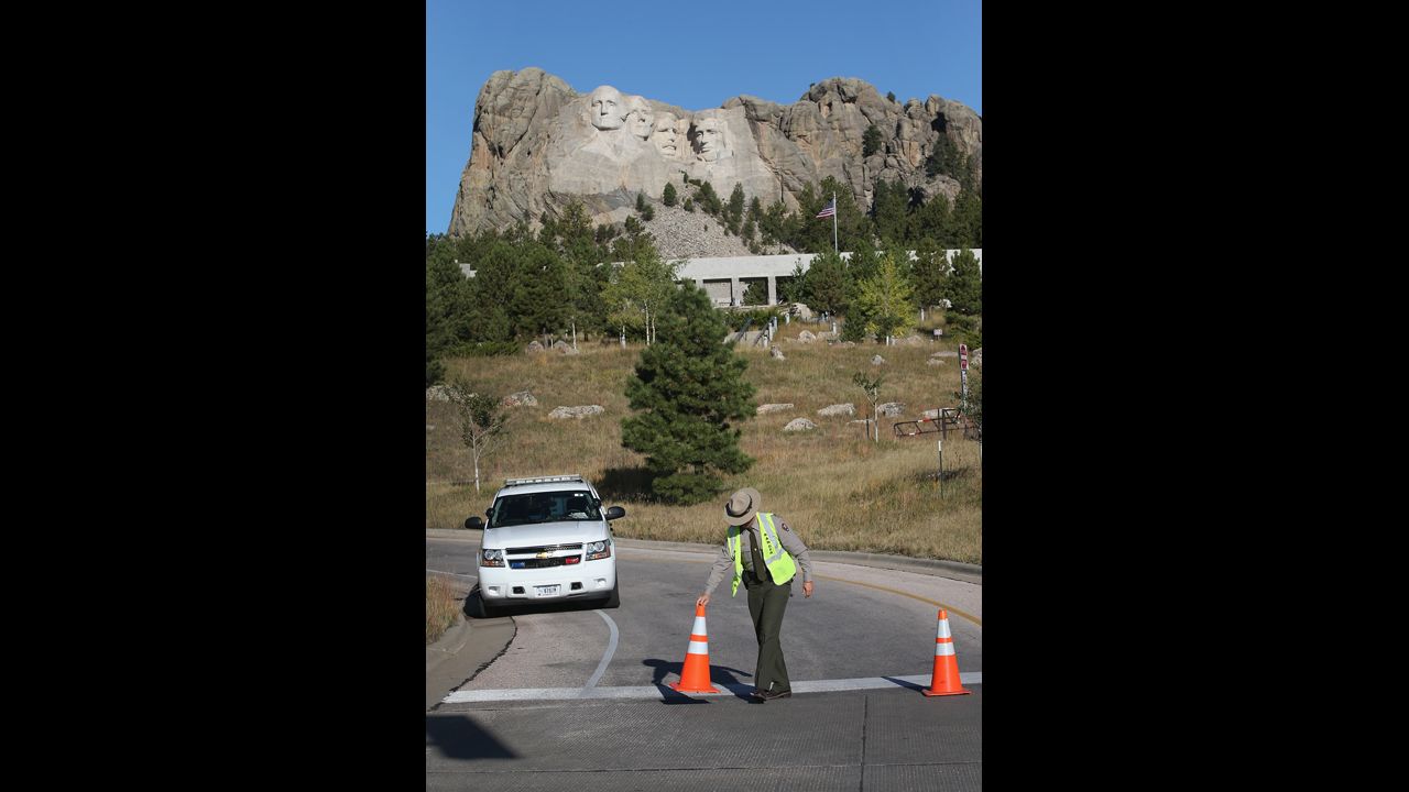 A park ranger secures a road at the entrance to the Mount Rushmore National Memorial on October 1 in Keystone, South Dakota.