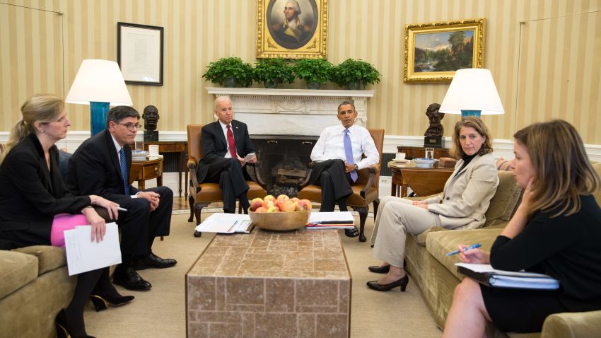 President Barack Obama and Vice President Joe Biden listen as they are updated on the federal government shutdown and the approaching debt ceiling deadline, in the Oval Office, Oct. 1, 2013. From left, Kathryn Ruemmler, Counsel to the President, Treasury Secretary Jack Lew, Sylvia Mathews Burwell, Director of OMB, and Alyssa Mastromonaco, Deputy Chief of Staff.
