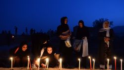 Afghan youth light candles in front of the destroyed palace of Darul Aman to mark the killing of 5000 civilians by the communist regime during the Russian occupation, in Kabul on September 29, 2013. Afghanistan began two days of official mourning for people killed by the communist regime in the late 1970s after a list of thousands of the dead was released. AFP PHOTO/ Massoud HOSSAINIMASSOUD HOSSAINI/AFP/Getty Images