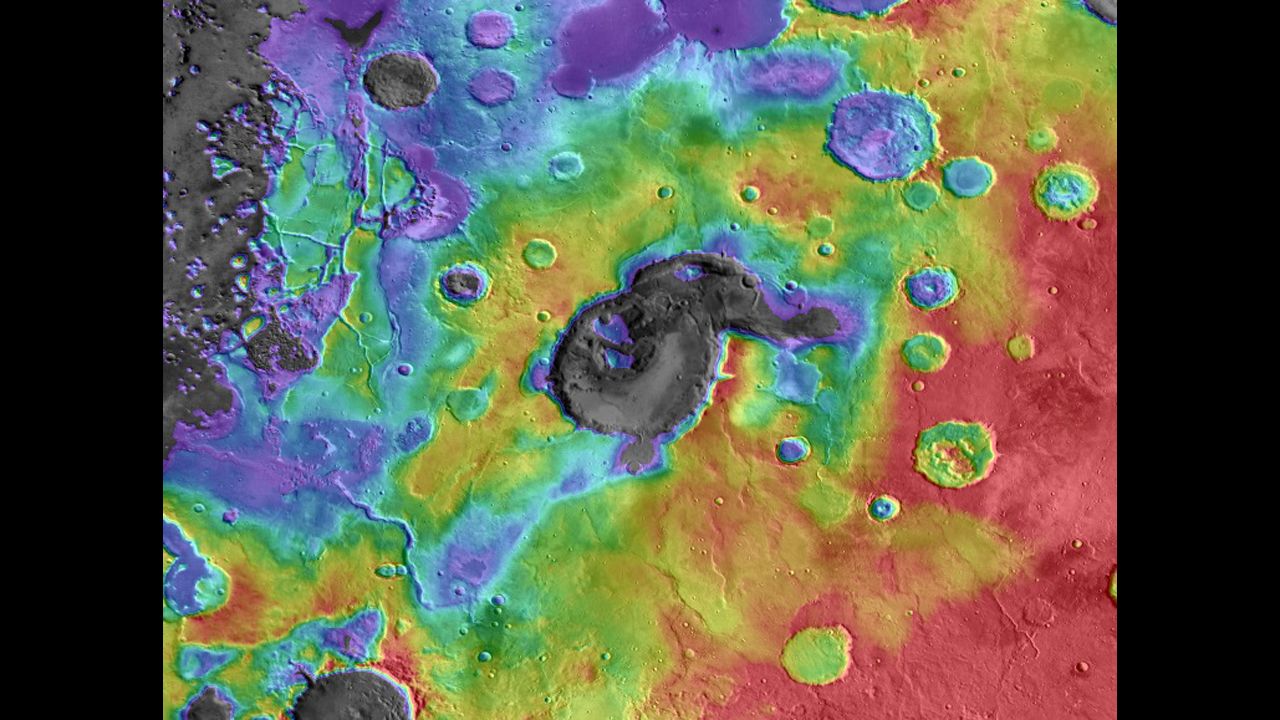Scientists believe this caldera, Eden Patera, on Mars is an ancient supervolcano. In this image of the caldera, digital-elevation data is overlaid on daytime thermal infrared images. (Red means higher elevations, while purple/gray means lower.) The crater in the middle is about 70 kilometers wide and 1,800 meters deep.