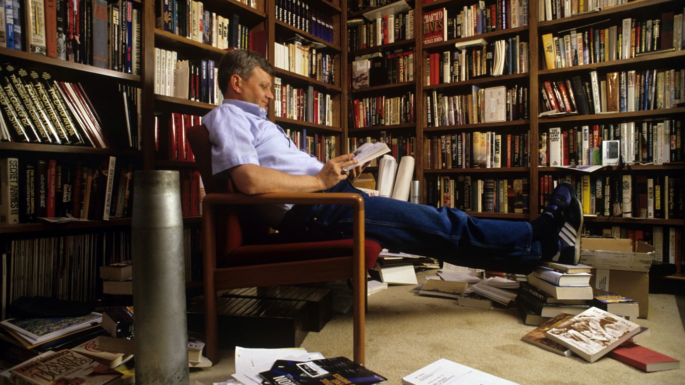 Clancy relaxes in his home library in Baltimore in 1988.