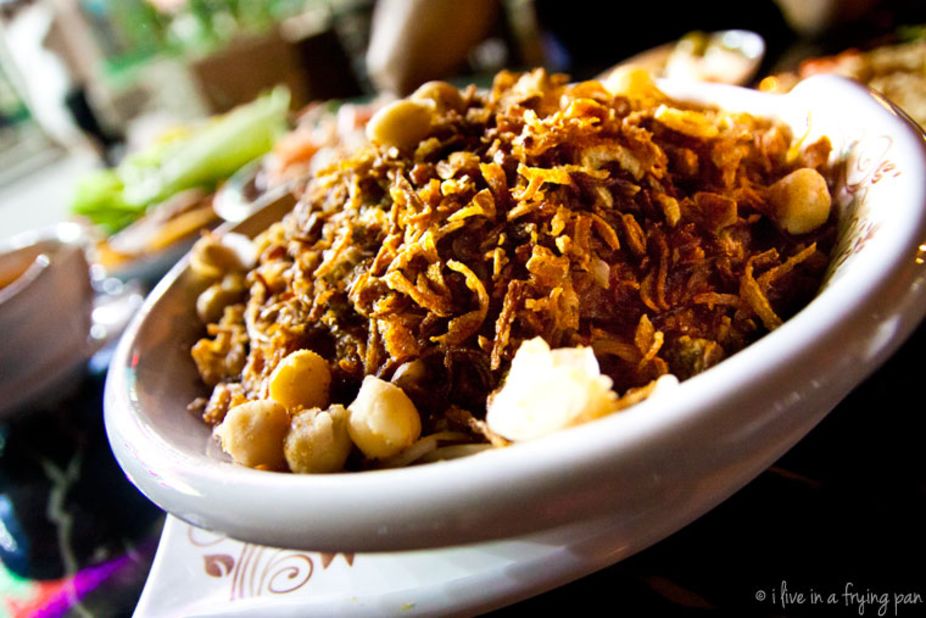 On the North African tour menu is koshari, the quintessential Egyptian comfort food -- a carb-heavy bowl of rice, pasta and macaroni, tossed with lentils, chickpeas, fried onions and a rich tomato sauce.
