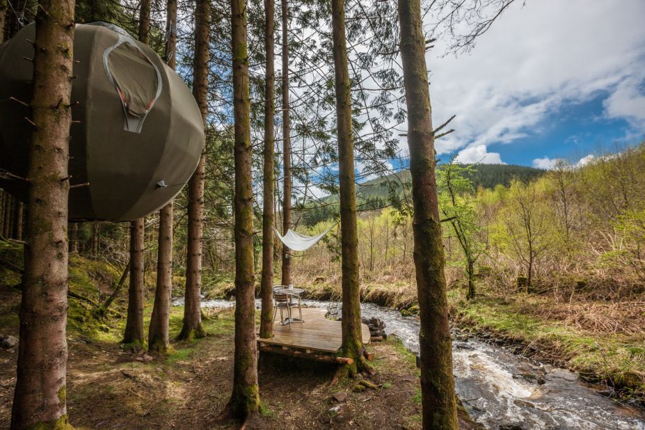 The Red Kite Tree Tents are canvas domes suspended from trees. They're large enough to accommodate two adults and there's even a wood-burning stove. The tents have electric lighting and are insulated for year-round use.