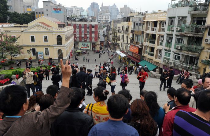 There are lots of people -- locals and tourists -- in a small place. You will be photo bombed.