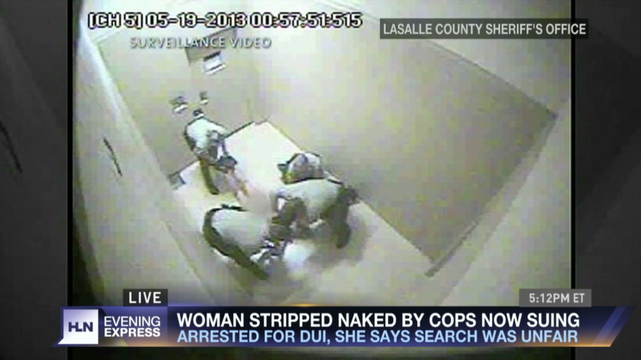 Four cops strip woman naked