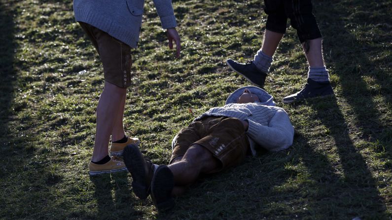 A man lays on the ground at the beer festival on October 2.