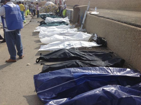 Bodies of drowned migrants are lined up at the port of Lampedusa on October 3.