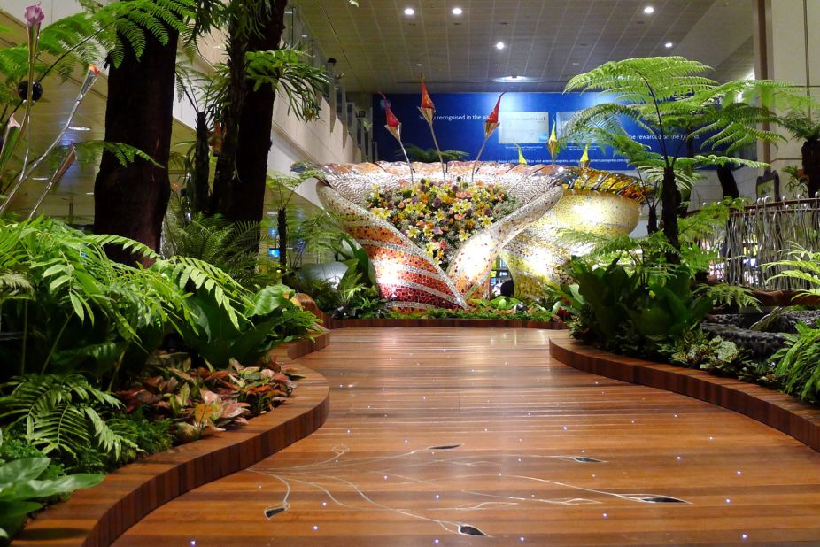 The Discovery Garden at T1 features tree-like sculptures and