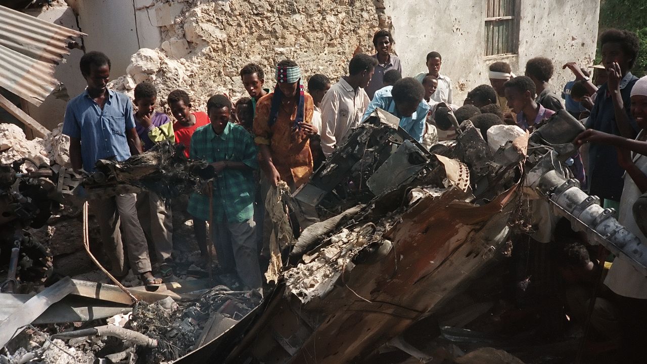 Somalis look at the wreckage of a U.S. helicopter in Mogadishu in October 1993.