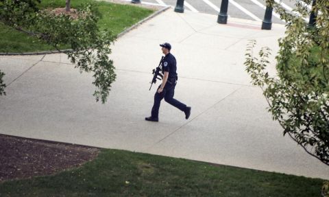 A police officer runs while reacting to a call of shots fired.