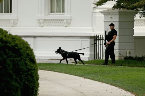 A member of the U.S. Secret Service counter-assault team patrols the grounds of the White House October 3 in Washington.