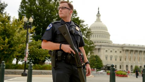 A U.S. Capitol Police Officer stands guard in front of the Capitol.