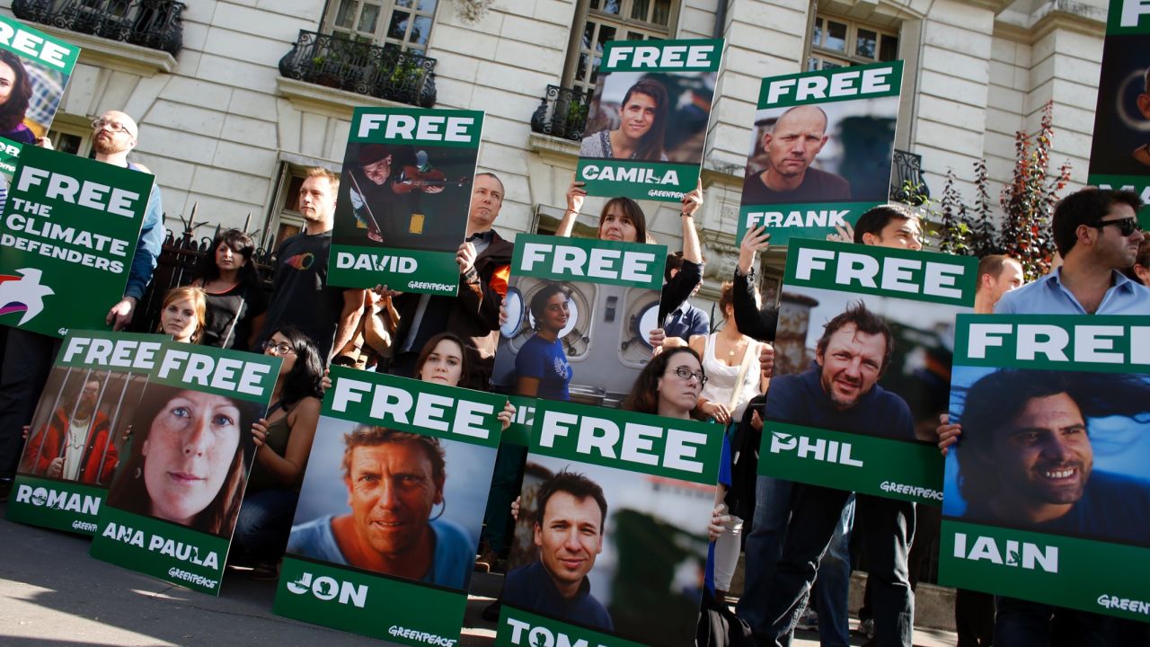 Greenpeace activists protest on September 27 in front of the Russian embassy in Paris.