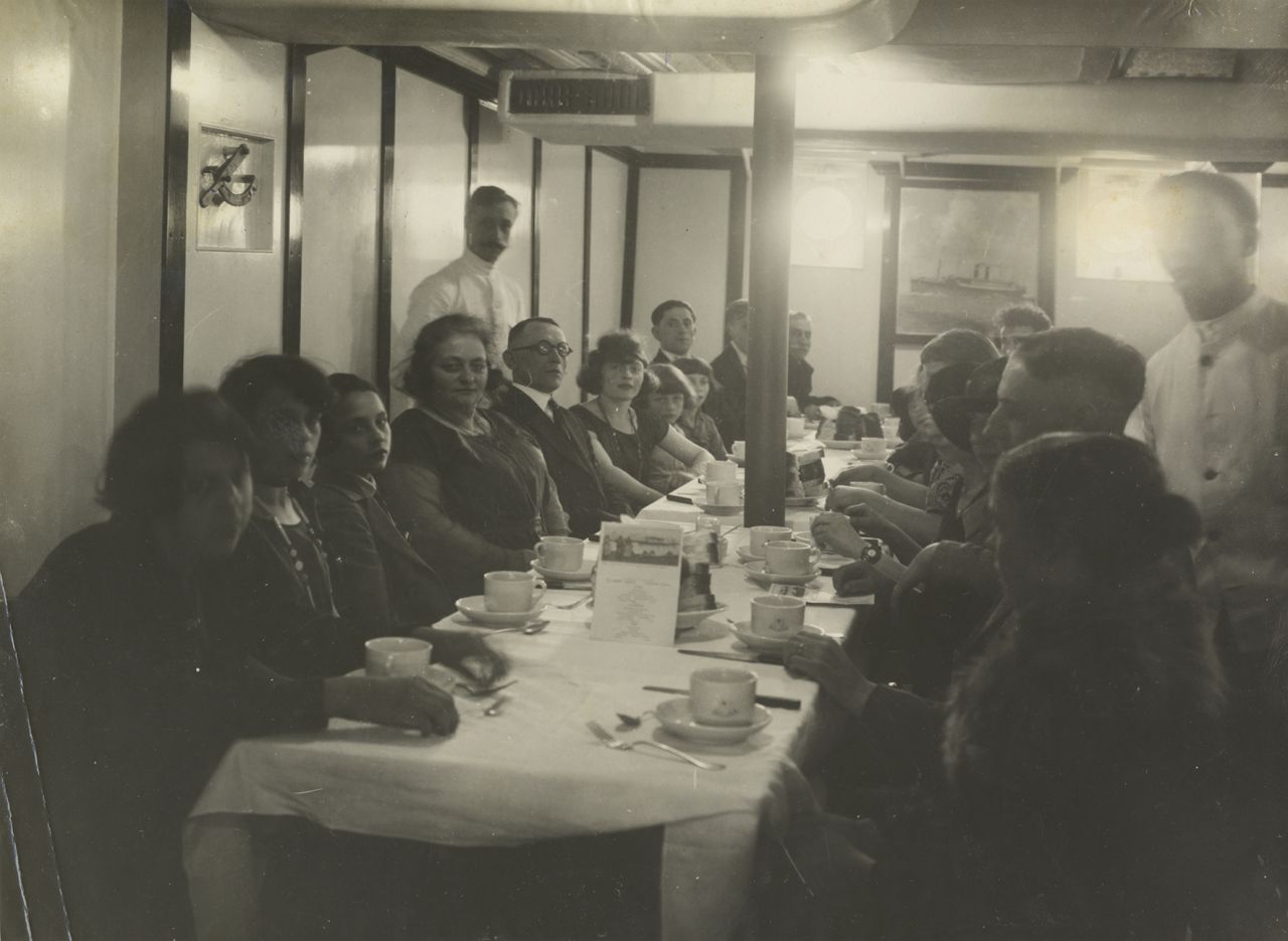 But traveling to the New World wasn't cheap, with a third class ticket costing the equivalent of $1,300 in today's money. Here, third class passengers dine in cramped conditions in 1925.  