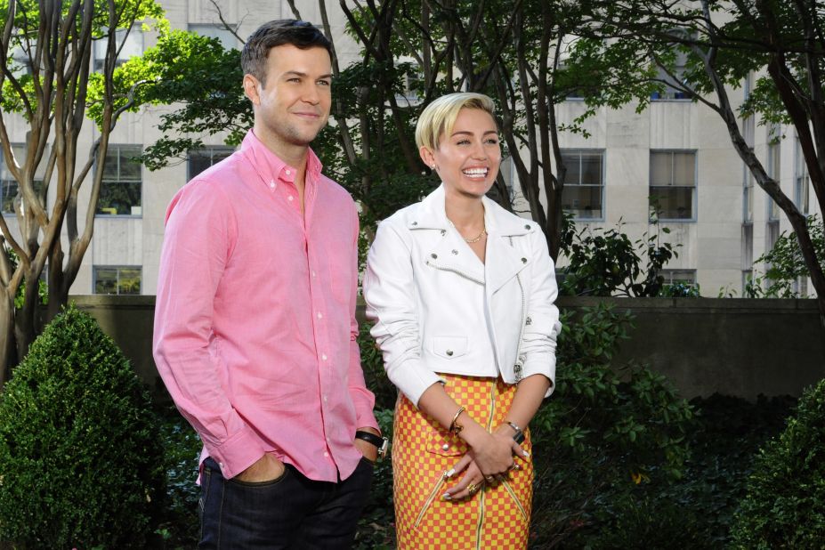 Taran Killam and Cyrus pose in a promo for her upcoming "Saturday Night Live" episode on October 5.