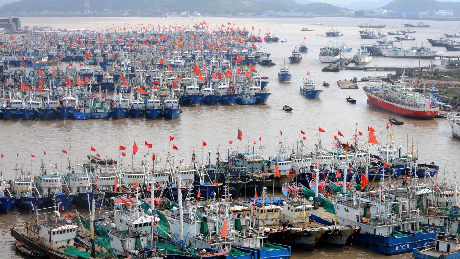 Fishing boats berth in Zhoushan port to avoid the powerful typhoon Fitow in Zhoushan, in east China's Zhejiang province on October 5, 2013.