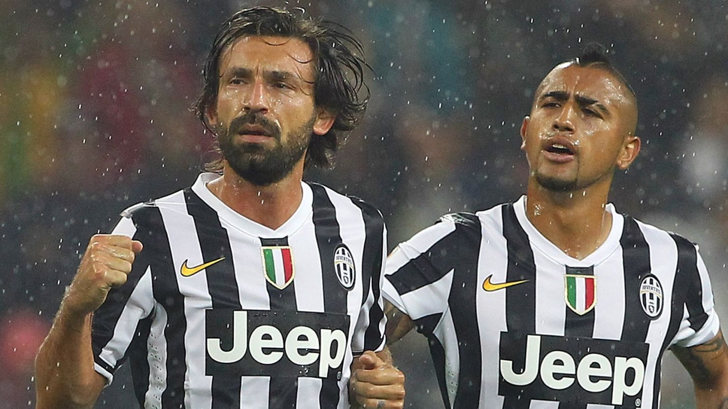 Juventus playmaker Andrea Pirlo with Arturo Vidal (right) after scoring in Sunday's 3-2 win against AC Milan.