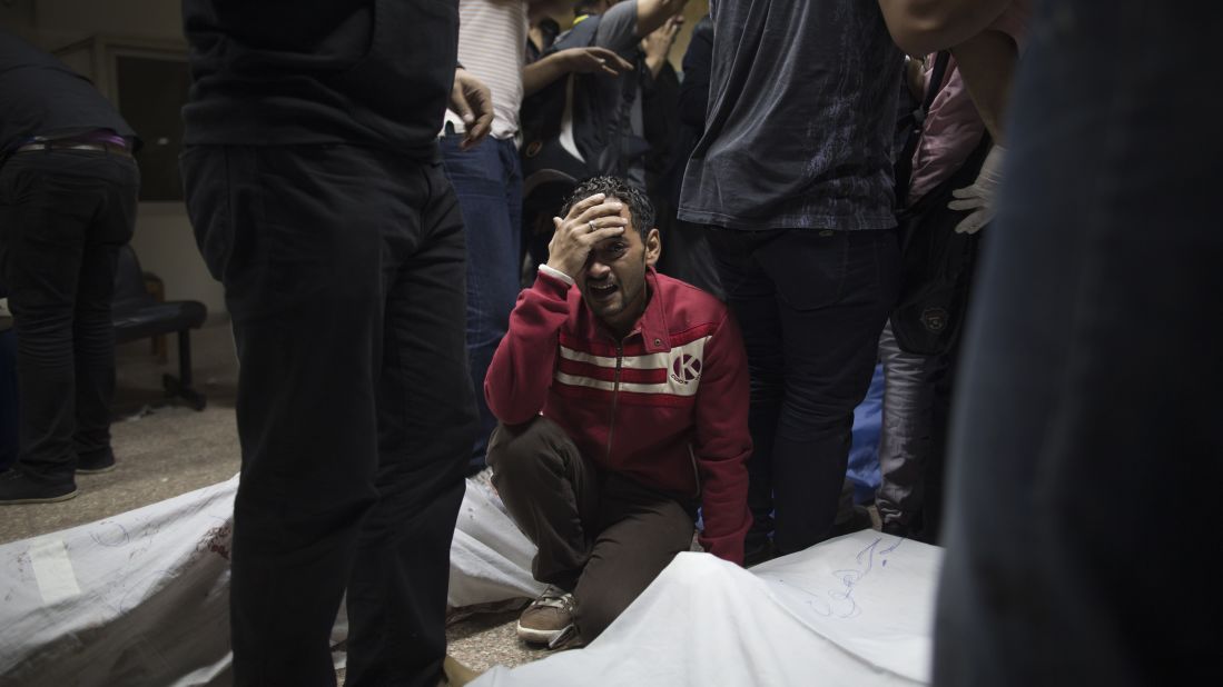 A Morsy supporter grieves for a relative killed during clashes with security forces on October 6 in Cairo.