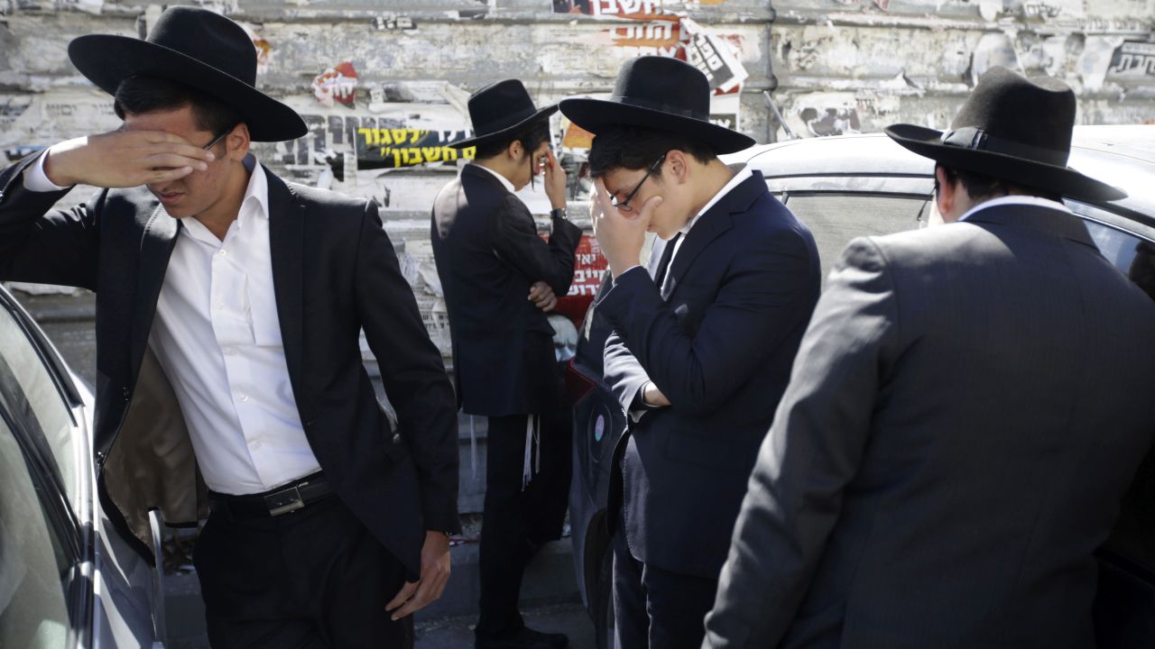 Mourners gather outside the Jerusalem home of <a href="http://www.cnn.com/2013/10/07/world/meast/israel-spiritual-leader-death/">Rabbi Ovadia Yosef</a>, the former Sephardic chief rabbi of Israel, on Monday, October 7. Yosef, 93, died after medical complications from a stroke he suffered earlier this year. He was considered the leading authority in religious rulings in the realm of Jewish law and was a founder of the ultra-Orthodox Shas Party, playing a pivotal role in Israeli politics. 