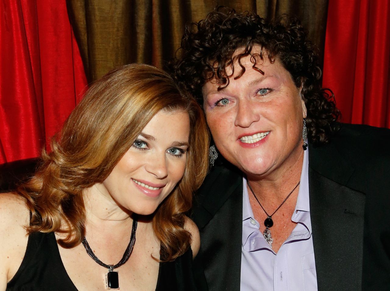 "Glee" actress Dot-Marie Jones, right, wed longtime girlfriend Bridgett Casteen in December 2013 at their home in Los Angeles.