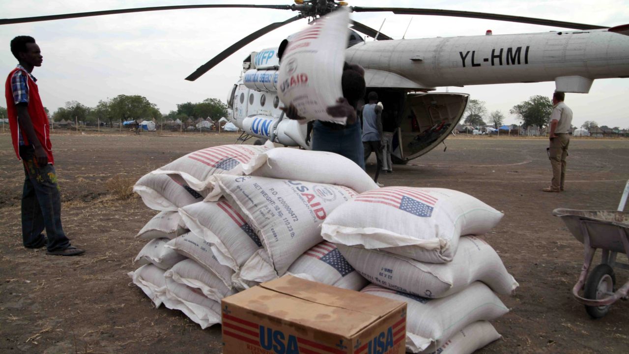 People in Jonglei state, South Sudan, unload aid from the U.N. World Food Program in January 2012. 