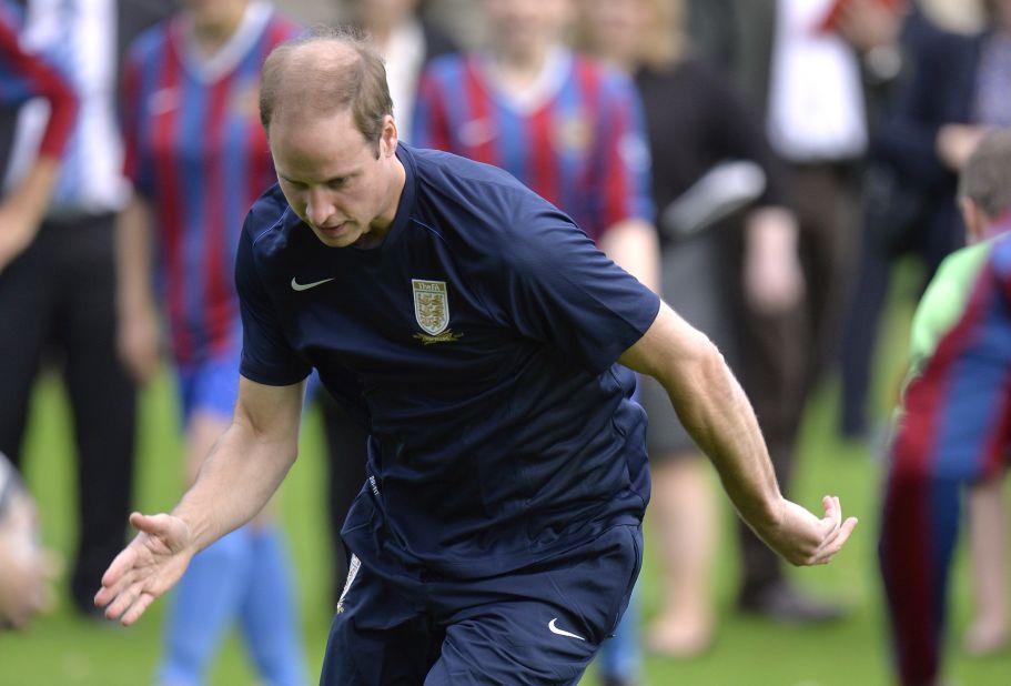 Prince William is a measure of concentration as he practices his skills in a training session with members of the Royal Household. 
