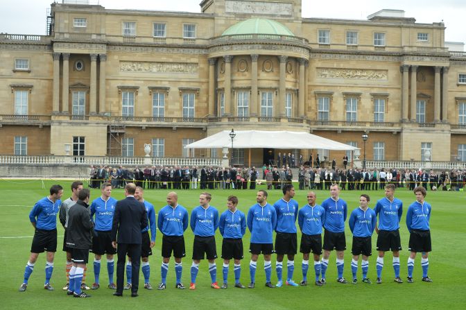 Prince William talks to the players ahead of the special match at Buckingham Palace to mark the 150th anniversary of the English FA.