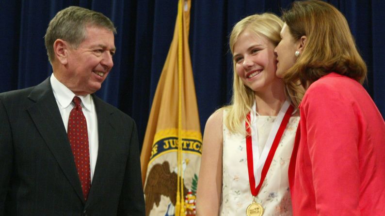 Smart and her mother with Attorney General John Ashcroft at a National Missing Children's Day event at the Justice Department in Washington in May 2004.