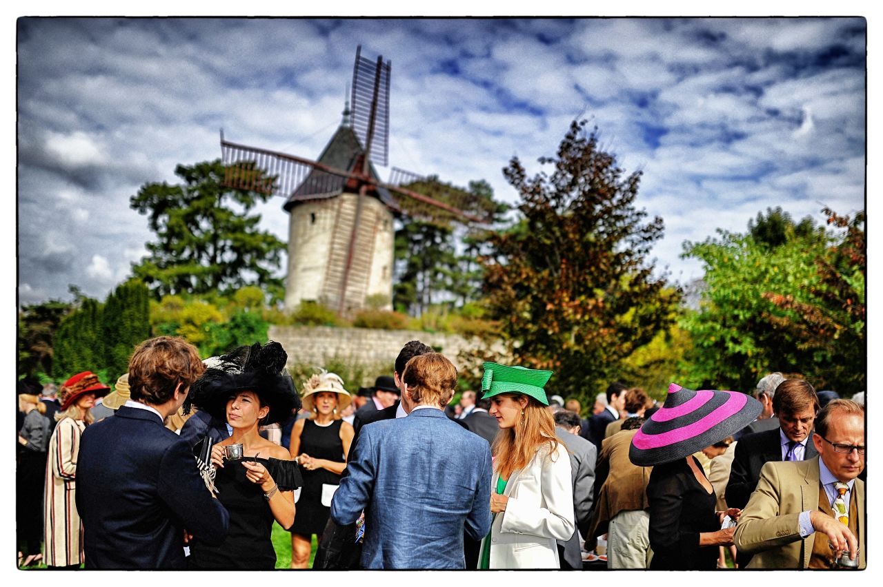 As Crowhurst's images reveal, a race meeting is as much about the drama off the track as it is on it. The photographer was at Longchamp in Paris for the Prix de l'Arc de Triomphe -- European racing's richest prize -- on Sunday to capture the windmills and hats as well as the racing.