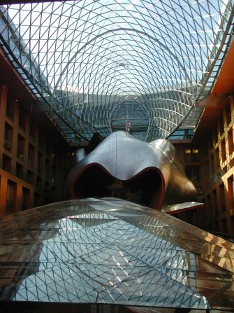 The simple facade of Frank O. Gehry's DZ Bank Building is a consequence of the strict provisions for the historical reconstruction of Pariser Platz, a square in Berlin. Apart from the fish-like shape of the glass roof, what makes this building special is the stainless steel-clad, mussel-shaped auditorium that "hovers" in the atrium.<strong>Architect</strong>: Frank O. Gehry