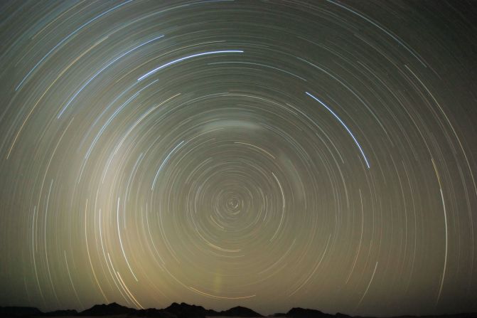 Thought to be over 55 million years old, the Namib Desert is free from light pollution, making it an ideal spot for stargazing. Pictured, an image of the desert's night sky, taken over two hours.