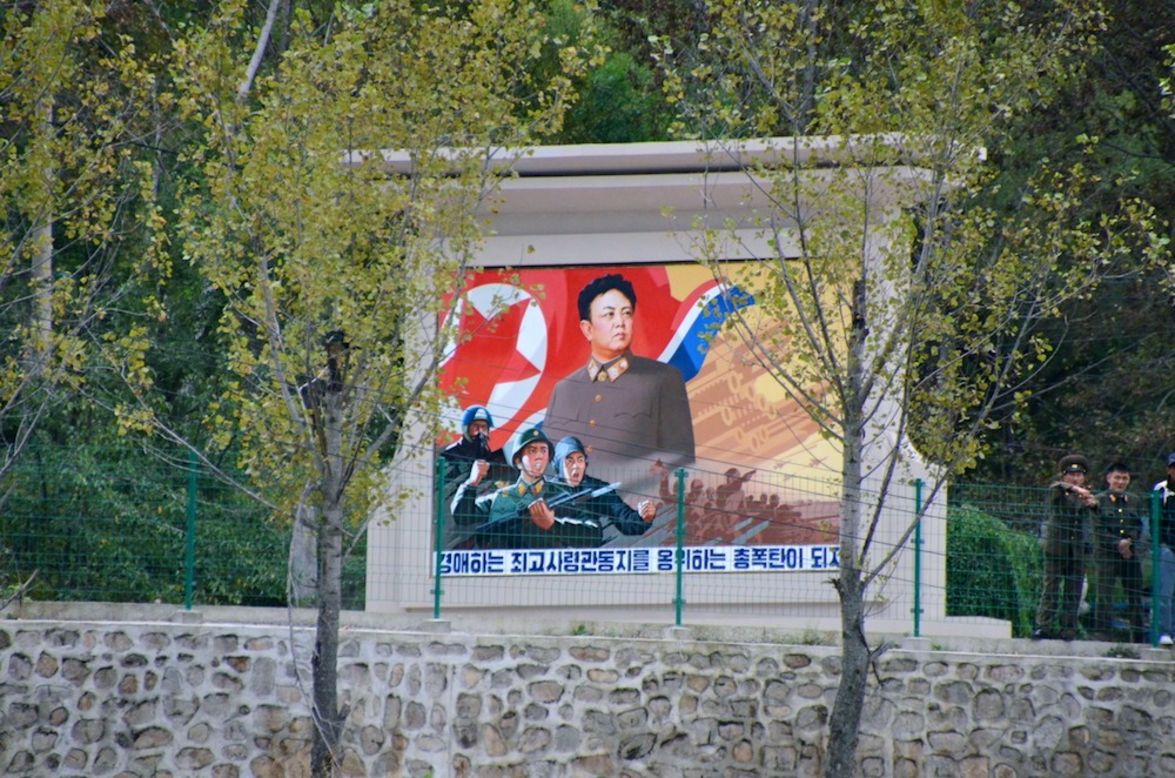 This propaganda monument of "Dear Leader" Kim Jong-Il by a countryside road, not far from the border to China, was deleted by authorities. North Korea required images of leaders be full body shots. 