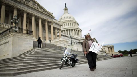 Rick Hohensee holds a "Fire Congress" sign near the House steps on Capitol Hill in Washington on Tuesday, October 8.