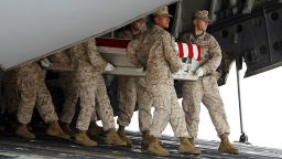 A Marine carry team, carries the transfer case containing the remains of Marine Lance Cpl. Jeremiah M. Collins Jr. of Milwaukee, Wis., upon arrival at Dover Air Force Base, Del. on Monday, Oct. 7,  2013. The Department of Defense announced the death of Collins Jr. who was supporting Operation Enduring Freedom in Afghanistan. ( AP Photo/Jose Luis Magana)