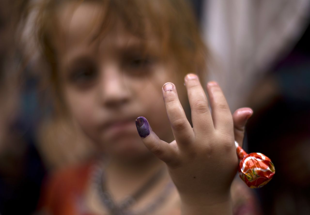 Polio, once a worldwide scourge, is endemic in just three countries now - Afghanistan, Nigeria and Pakistan.  Pictured here is Ameena, a Pakistani girl participating in an anti-polio campaign, showing her ink-marked finger after being vaccinated for polio in Rawalpindi, Pakistan, Monday, October 7, 2013.