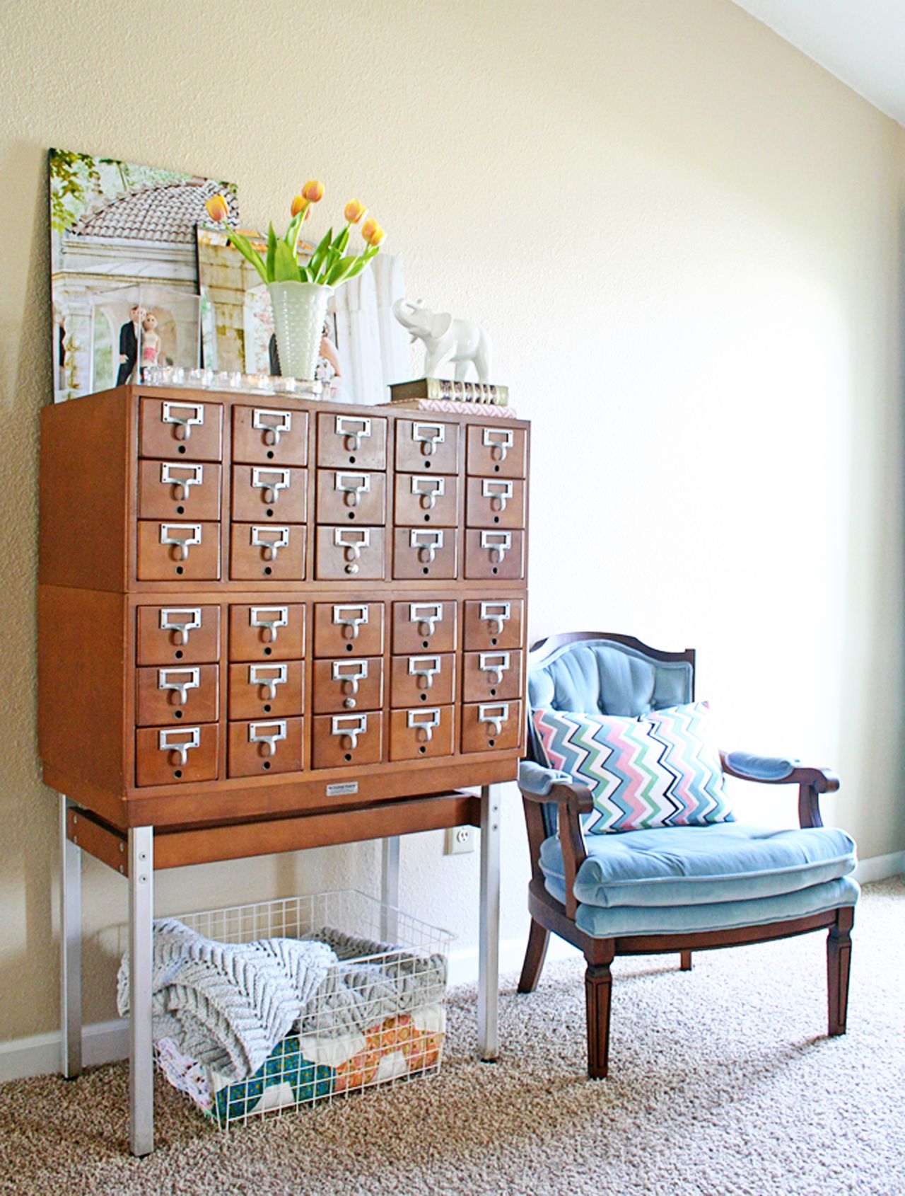 McDonnough loves elephants, and included a petite elephant planter to the top of her vintage library card catalog.