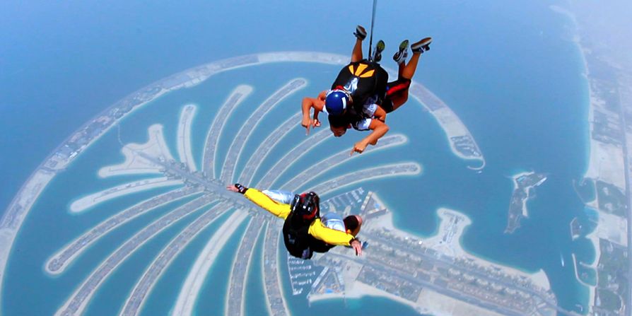 Answer: Dubai, home to the Palm Islands development (here, pictured from on high) and the world's largest building in the shape of the Burj Khalifa.