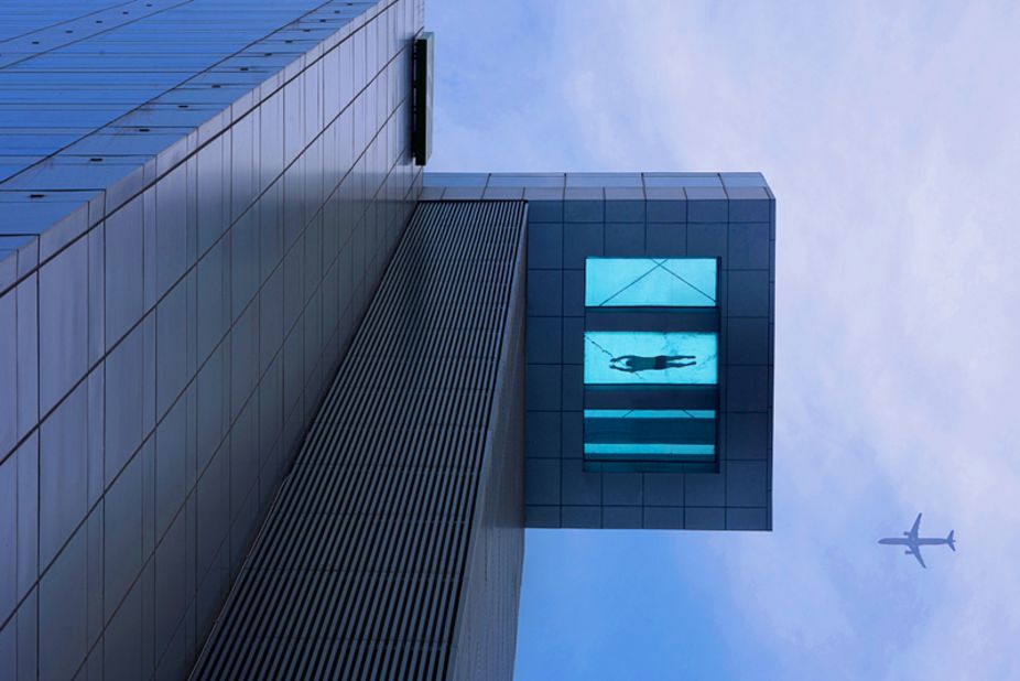 At the Holiday Inn Shanghai Kangqiao, the glass-bottomed pool, located on the 24th floor, measures 30 meters (98 feet) in length and half of the pool protrudes out from the building over the street below.