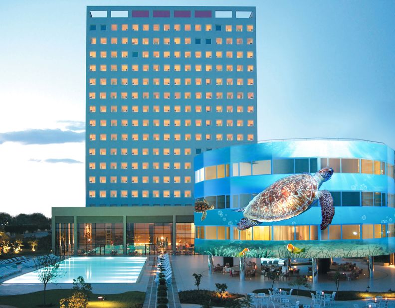 Marmara Antalya is the world's first revolving hotel. The 2,750-ton building floats in a tank holding 478 tons of water. The hotel's three lower floors are submerged, and it's the three floors above ground which rotate, with the help of six electric motors. 