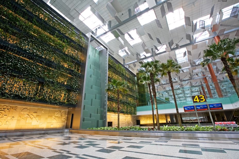 Changi Airport's green wall, in terminal three, is the world's largest vertical garden, measuring 300 meters (984 feet) by 14 meters (45 feet). It contains more than 10,000 plants. There are four water features and plants are secured to metal cables attached to an enormous framework, which allows their position to be altered. 