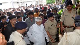 Lalu Prasad Yadav (C), a former Indian federal minister, whose Rashtriya Janata Dal party supports the ruling coalition, walks into court before a hearing in Ranchi, Jharkhand on September 30, 2013. An Indian court convicted, Yadav, a regional government ally, of corruption making him one of the first politicians set to be disqualified from parliament under new rules barring criminal MPs. AFP PHOTO/ STRSTRDEL/AFP/Getty Images