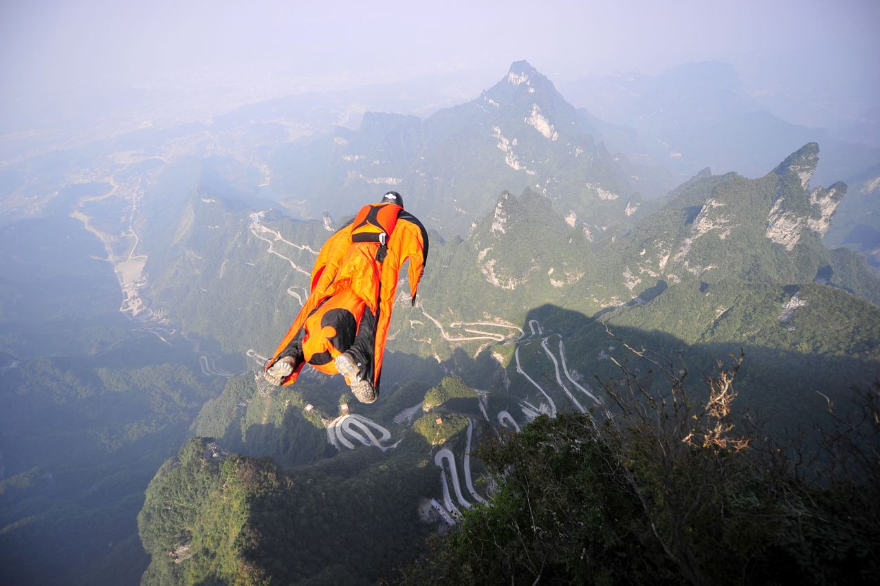 Hungarian wingsuit flier Victor Kovats jumps into a valley in Tianmen Mountain National Forest Park in Zhangjiajie, China, on Tuesday, October 8. Kovats died after his parachute failed to deploy and he plummeted into the valley. His body was found October 9.
