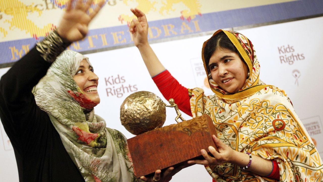 Malala receives a trophy from Yemeni civil rights activist Tawakkol Karman after being honored with the International Children's Peace Prize in The Hague, Netherlands, in September 2013. Karman was one of the Nobel Peace Prize winners in 2011.