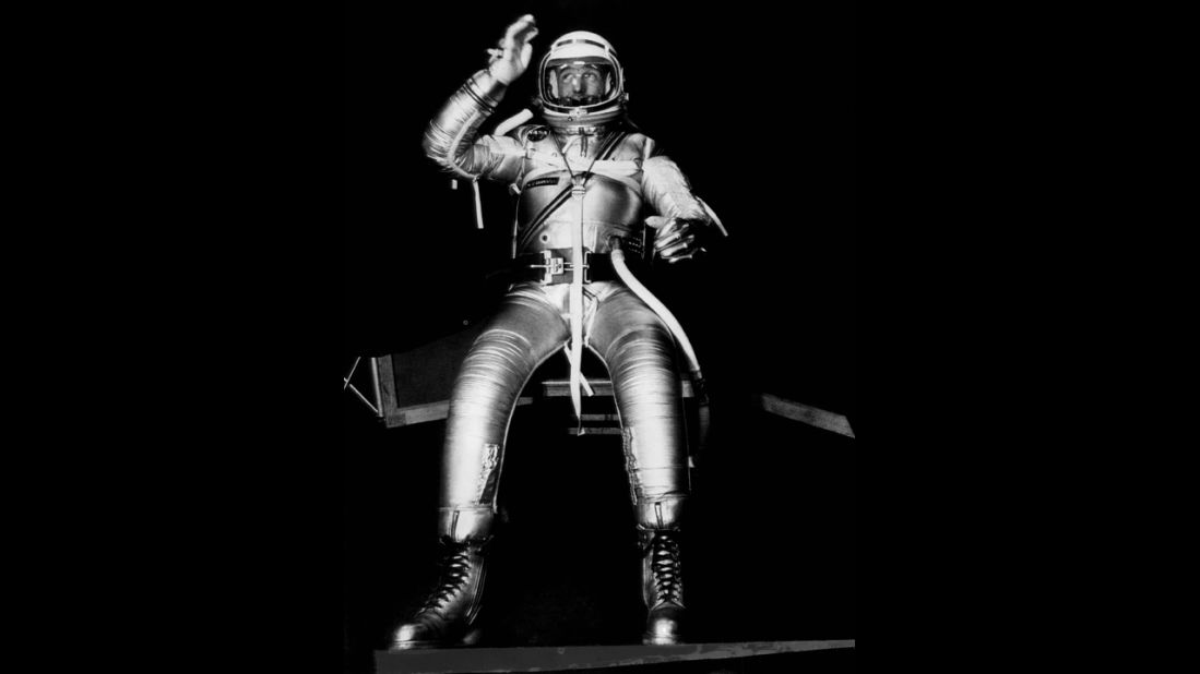 Carpenter, one of seven men being trained for space flight, tests  the mobility of a full pressure suit being developed for use by the Project Mercury trainees. The suit was a prototype designed to protect the astronauts from heat and pressure conditions expected to be encountered during flight. The tests were conducted at the Navy Air Material Center in Philadelphia, Pennsylvania, on November 23, 1959.
