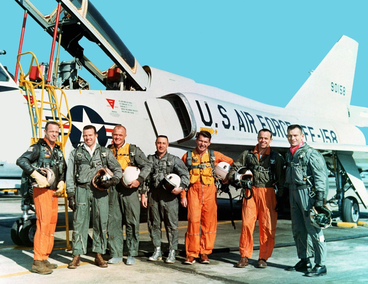 The original seven Mercury astronauts are shown in their flight suits during training at NASA Langley Research Center in March 1961. From left: Lt. Carpenter, Capt. Gordon Cooper, Col. John H. Glenn Jr., Capt. Virgil "Gus" Grissom, Lt.  Cmdr. Walter Schirra, Lt. Cmdr. Alan B. Shepard Jr. and Capt. Donald  K. "Deke" Slayton.  