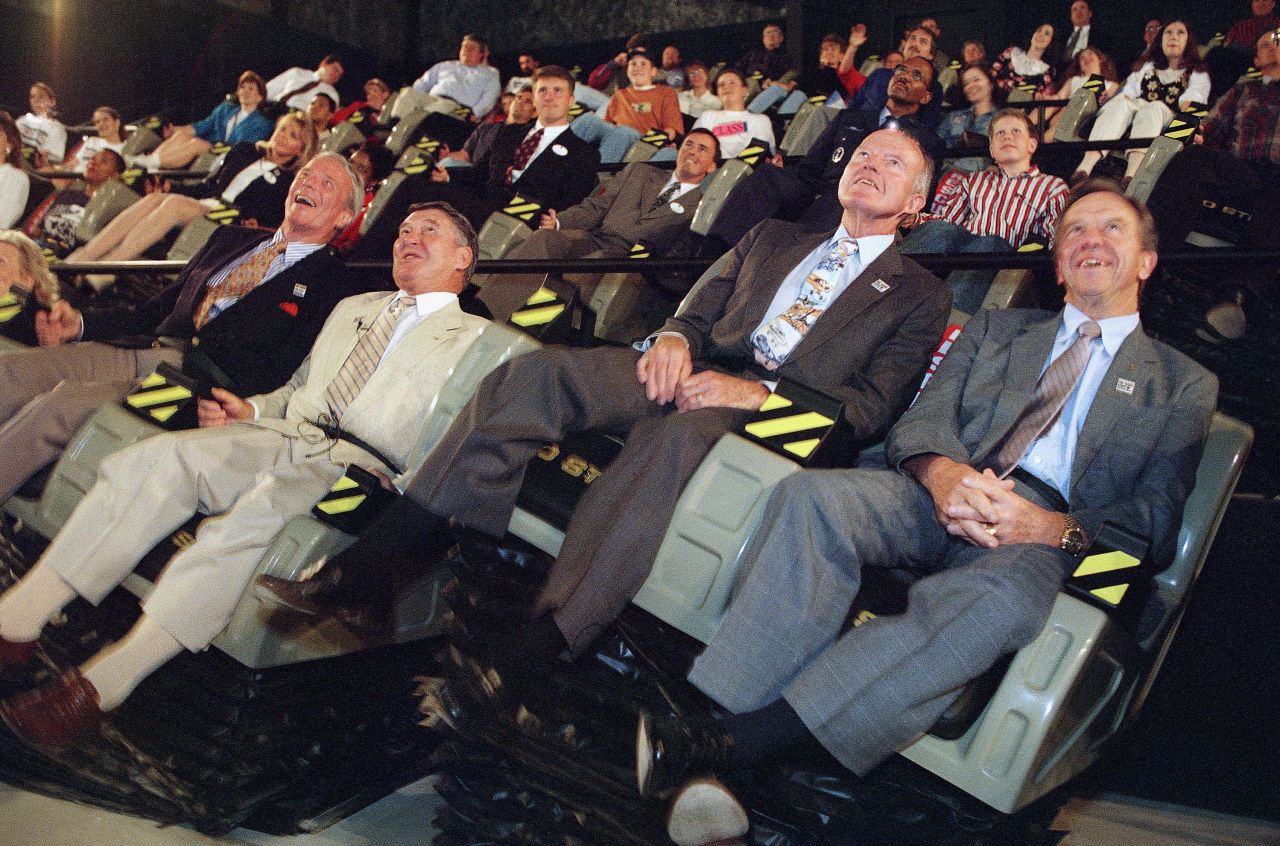 Carpenter, left, with former Mercury 7 astronauts Wally Schirra, Gordon Cooper and Alan Shepard as they ride "The Right Stuff" Mach one flight simulation on April 28, 1995, at Six Flags Over Texas in Arlington, Texas. The 100-seat theater involves a five-story high screen and seats that move to help simulate flight vibrations. 