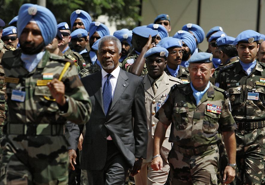 Former United Nations Secretary General Koffi Annan, center, with French Forces commander Gen. Alain Pellegrini, right, review UNIFIL soldiers upon Annan's arrival to the U.N. peacekeeping base in the southern Lebanese town of Naqura, on August 29, 2006. Annan and the United Nations won the Nobel Peace Prize in 2001. 